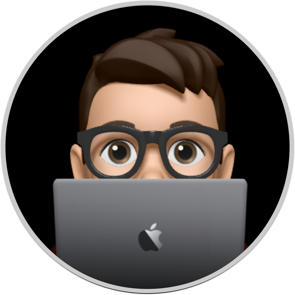 Joe's Memoji behind a Space Grey MacBook Pro.