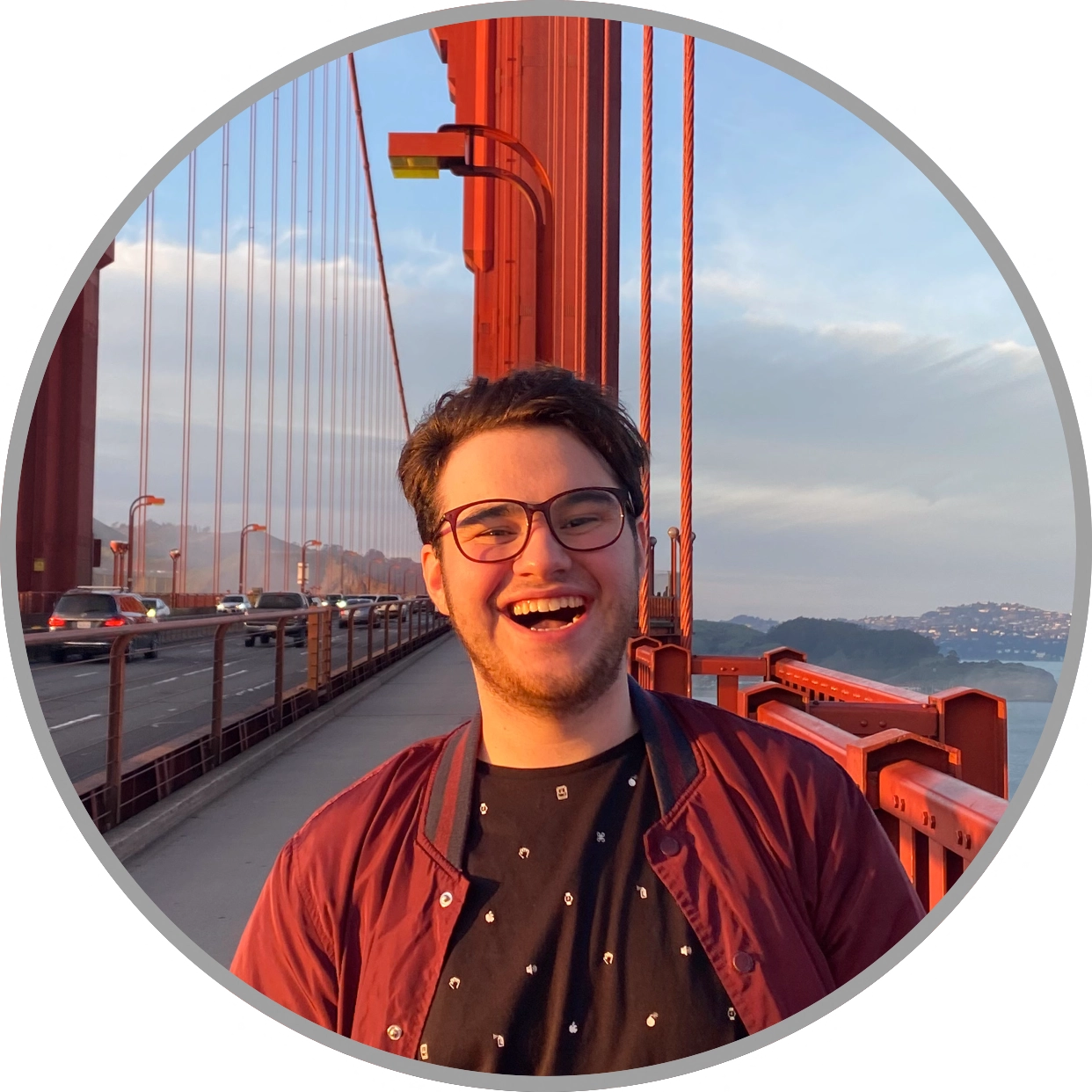 Image of Joe smiling while standing on the golden gate bridge in San Francisco, CA. 